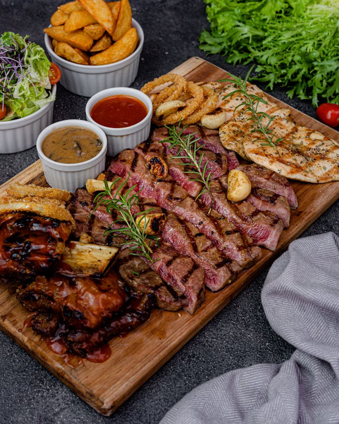 Savor this delectable meat selection with sauces and crispy wedges.